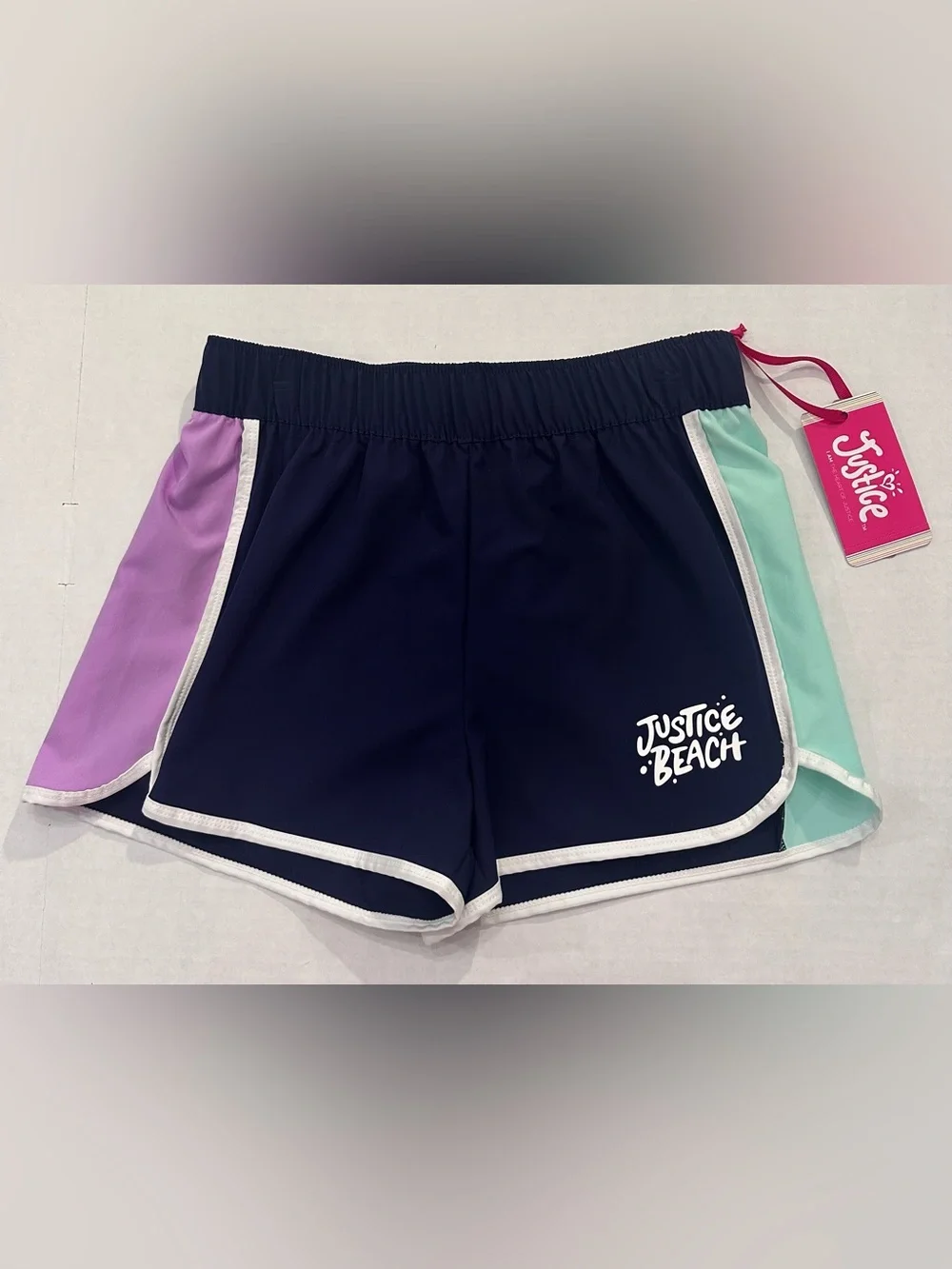 Justice Girls Lilac Butterfly Tank Top and a Pair of Justice Beach Board Shorts